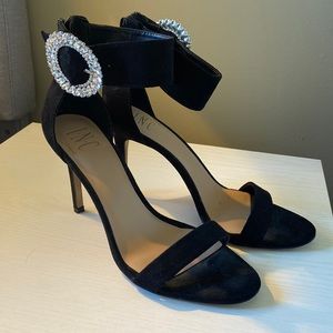 Black INC heels with silver circle buckle size 10